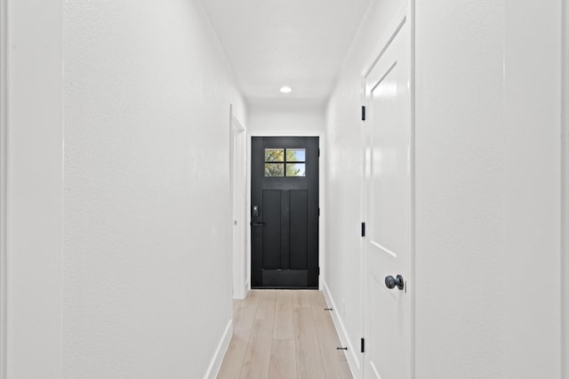 doorway to outside featuring light hardwood / wood-style flooring