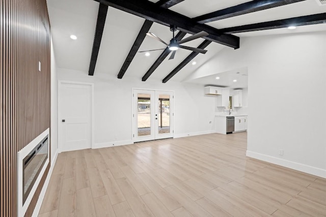 unfurnished living room featuring light wood-type flooring, french doors, vaulted ceiling with beams, and ceiling fan