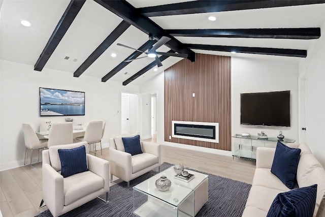 living room featuring high vaulted ceiling, ceiling fan, beam ceiling, a large fireplace, and wood-type flooring