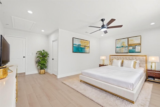 bedroom with ceiling fan and light hardwood / wood-style floors