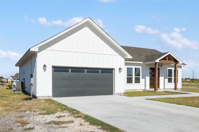 modern farmhouse featuring central AC and a garage