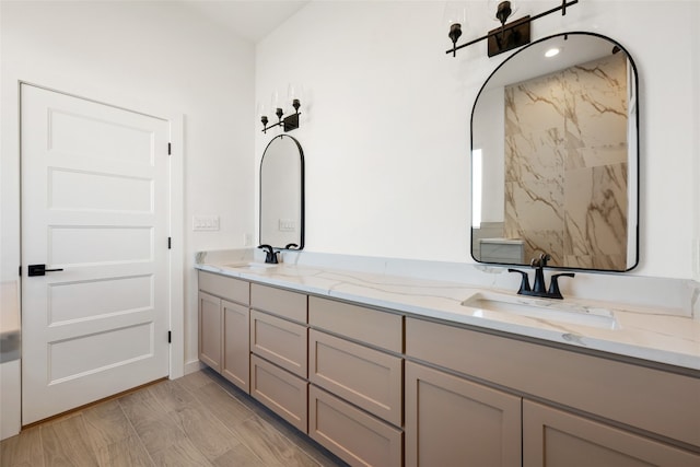 bathroom with vanity and hardwood / wood-style floors