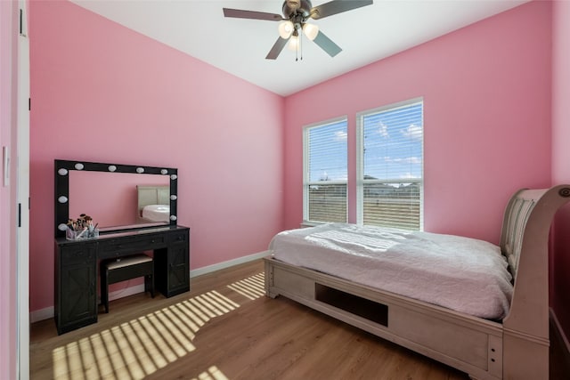 bedroom with hardwood / wood-style flooring and ceiling fan