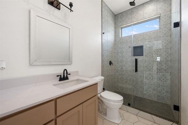 bathroom with toilet, an enclosed shower, vanity, and tile patterned floors