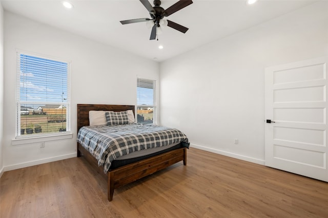 bedroom featuring wood-type flooring and ceiling fan