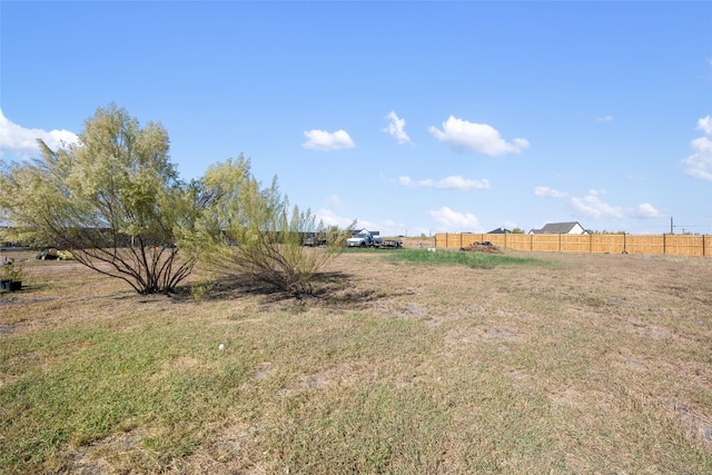 view of yard with a rural view