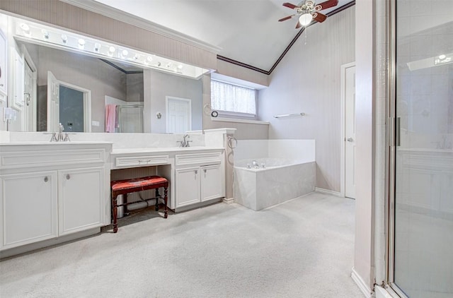 bathroom with vaulted ceiling, a shower stall, a ceiling fan, double vanity, and a bath