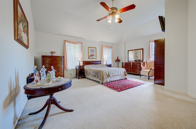 carpeted bedroom with ceiling fan and lofted ceiling