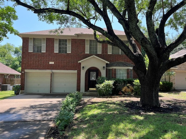 11205 Appletree Ln, Austin, TX 78726 - view of front of home featuring a garage, concrete driveway, central AC unit, and brick siding