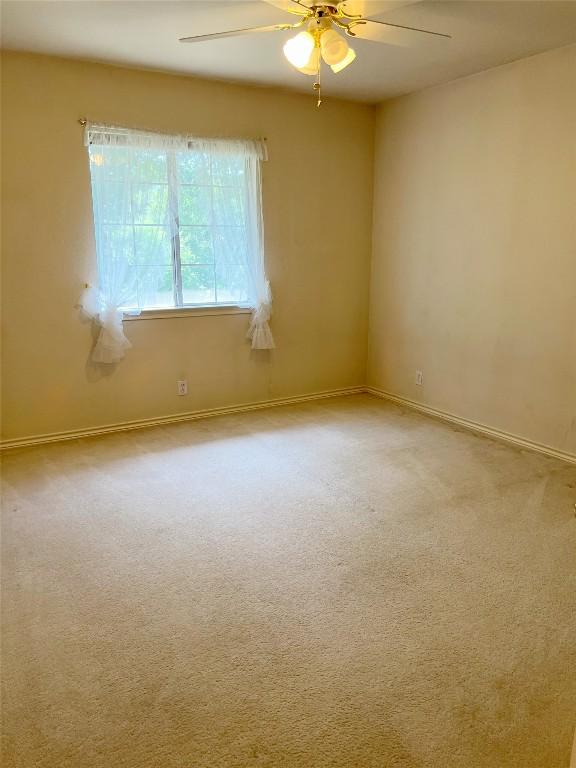 11205 Appletree Ln, Austin, TX 78726 - carpeted empty room with ceiling fan and baseboards