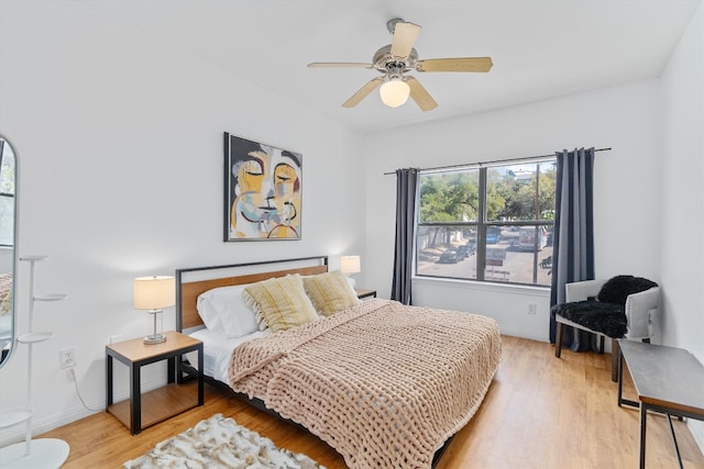 bedroom featuring wood-type flooring and ceiling fan