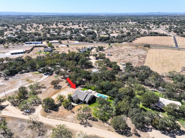 birds eye view of property featuring a rural view