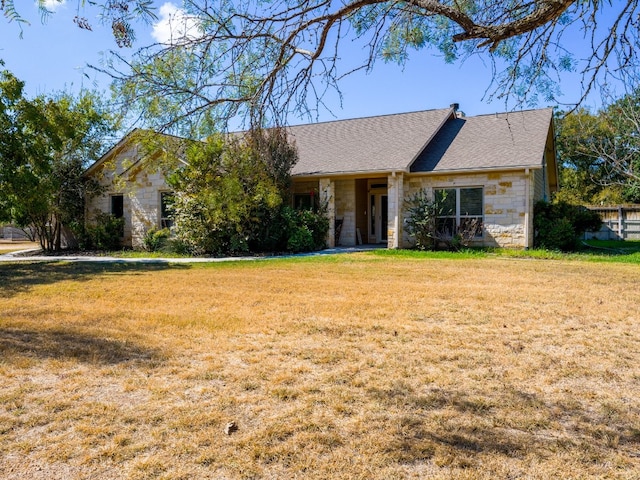 single story home featuring a front yard