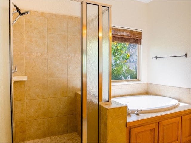 bathroom with shower with separate bathtub