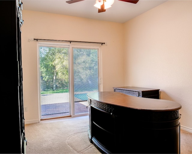 office featuring light carpet and ceiling fan