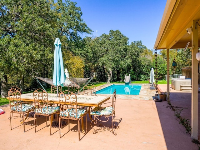 view of pool featuring a patio