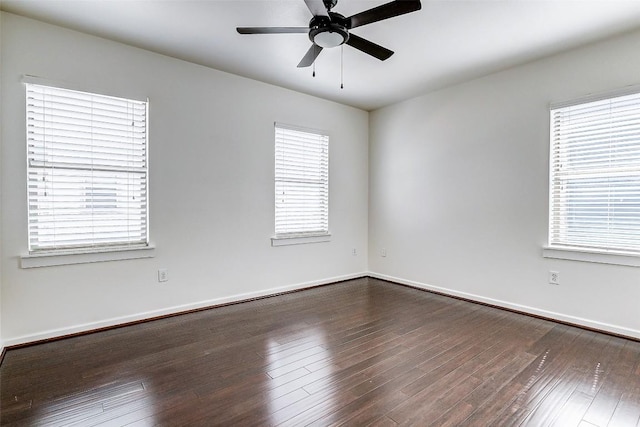 1201 Grove Blvd Unit 2403, Austin, TX 78741 - empty room with dark wood finished floors, baseboards, and a ceiling fan