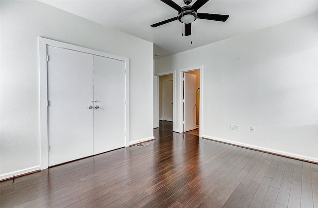 1201 Grove Blvd Unit 2403, Austin, TX 78741 - unfurnished bedroom featuring wood finished floors, visible vents, a ceiling fan, a closet, and baseboards