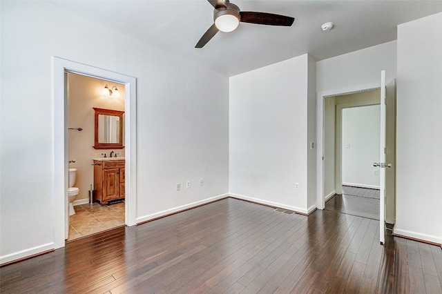 1201 Grove Blvd Unit 2403, Austin, TX 78741 - unfurnished room featuring a ceiling fan, wood finished floors, a smoke detector, and baseboards