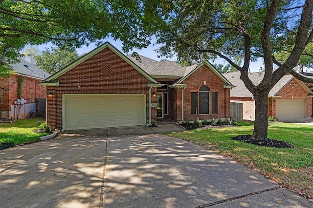 view of front of home with a garage, driveway, brick siding, roof with shingles, and a front yard