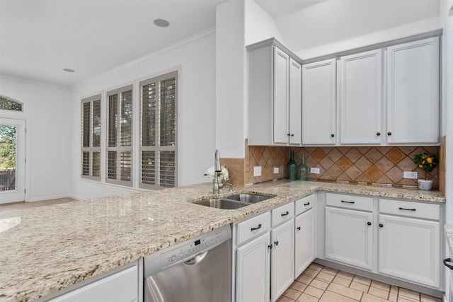 kitchen with decorative backsplash, light stone counters, stainless steel dishwasher, sink, and light tile patterned floors