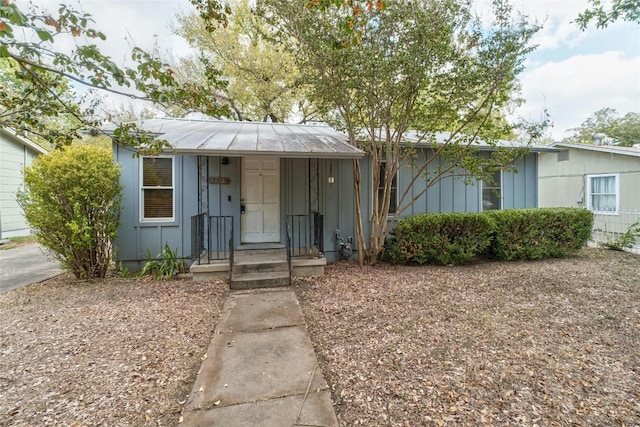 4804 Tanney St, Austin, TX 78721 - view of front facade featuring board and batten siding and metal roof