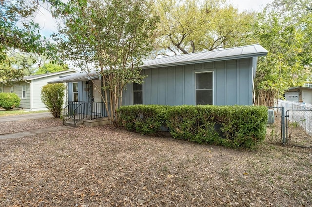 4804 Tanney St, Austin, TX 78721 - view of front of home featuring board and batten siding and a gate