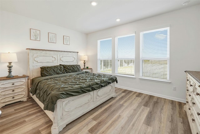 bedroom with light wood-type flooring