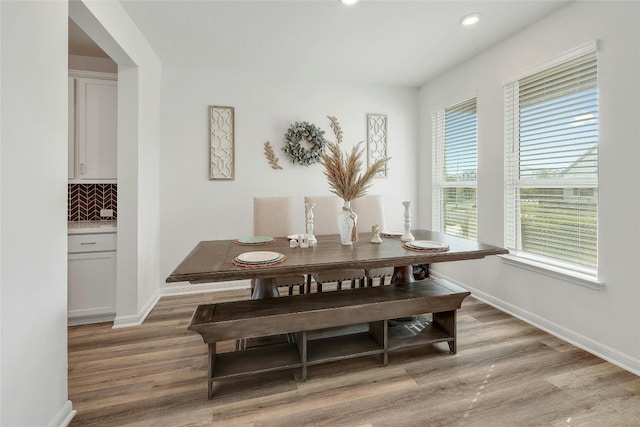 dining space featuring light wood-type flooring