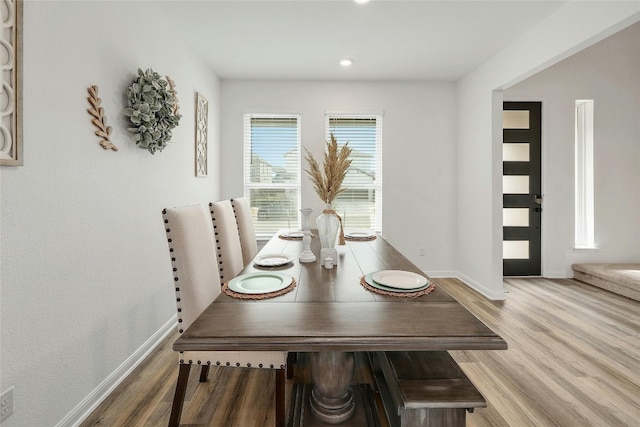 dining room with wood-type flooring