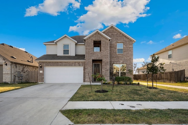 view of front of house with a front yard and a garage