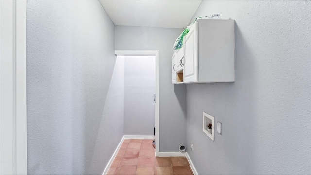 laundry area with washer hookup and baseboards