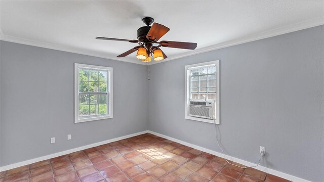 empty room with ornamental molding, baseboards, a ceiling fan, and cooling unit