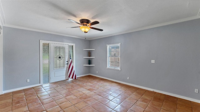 spare room with a ceiling fan, ornamental molding, a textured ceiling, baseboards, and light tile patterned floors
