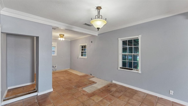 empty room with ornamental molding, a ceiling fan, and baseboards
