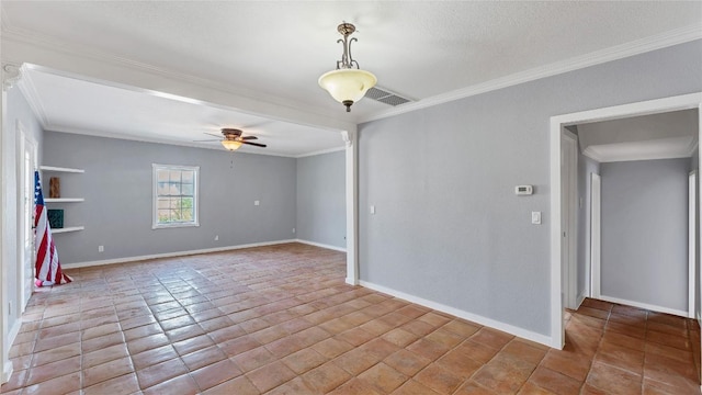 empty room featuring crown molding, ceiling fan, and baseboards