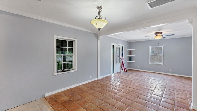 tiled empty room featuring ornamental molding, a ceiling fan, and baseboards