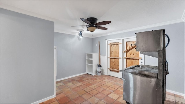 exercise room with a ceiling fan, crown molding, and baseboards
