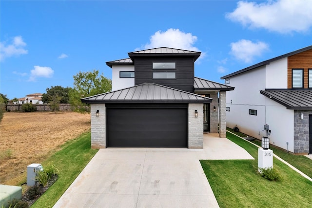 view of front facade featuring a front lawn and a garage