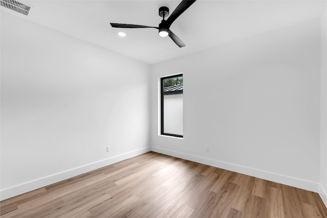 empty room with light hardwood / wood-style floors and ceiling fan