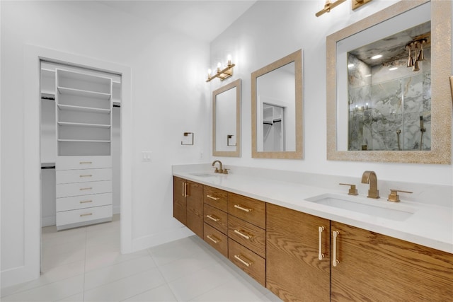 bathroom with vanity, tile patterned flooring, and walk in shower