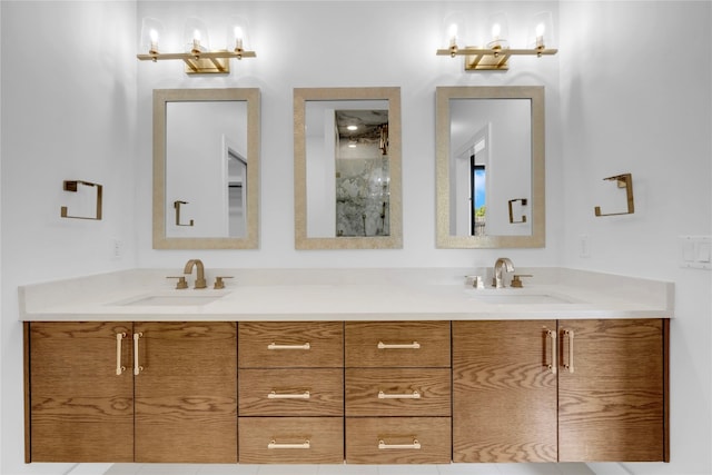 bathroom featuring a shower with door and vanity