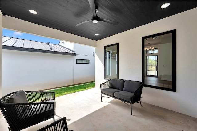 view of patio / terrace featuring ceiling fan and an outdoor living space