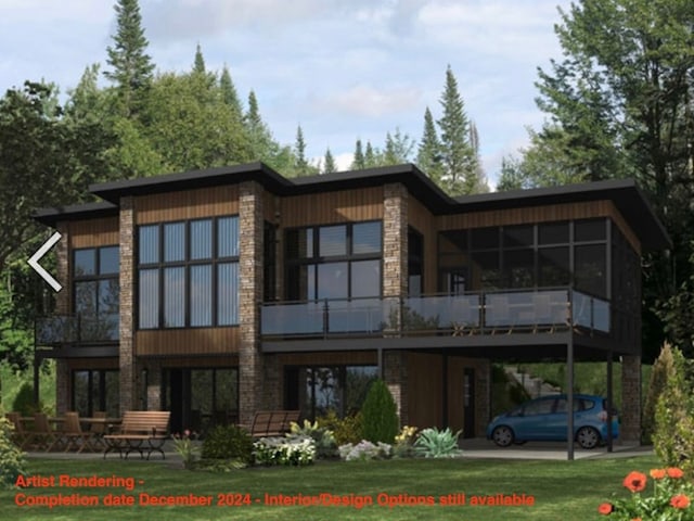 rear view of house with a sunroom and a carport