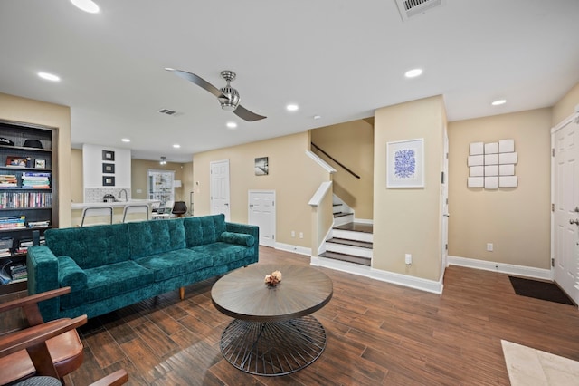 living room with ceiling fan and hardwood / wood-style floors