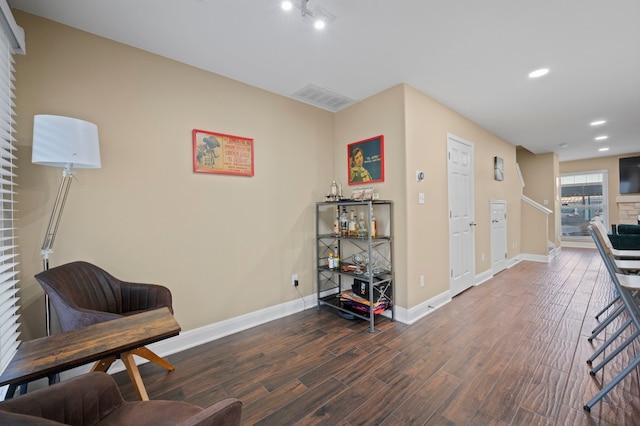 sitting room featuring dark hardwood / wood-style floors