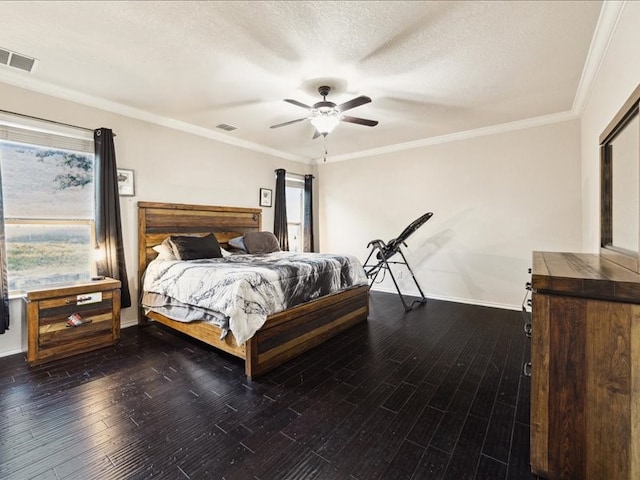 bedroom featuring ceiling fan, crown molding, a textured ceiling, and dark hardwood / wood-style flooring