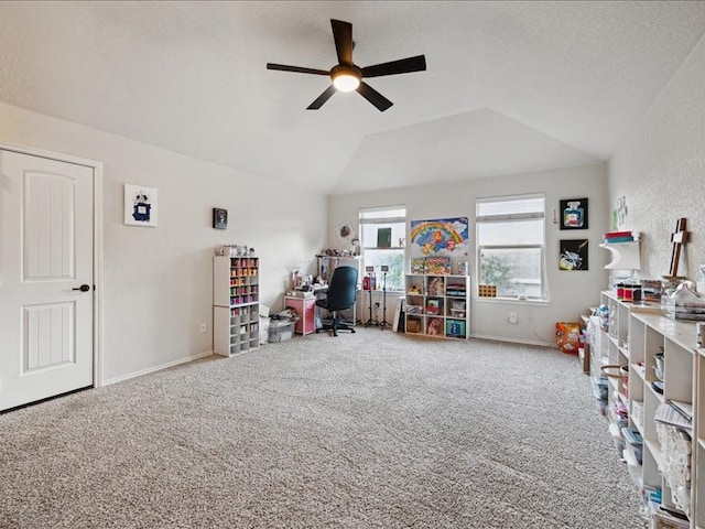 game room with ceiling fan, carpet flooring, and vaulted ceiling