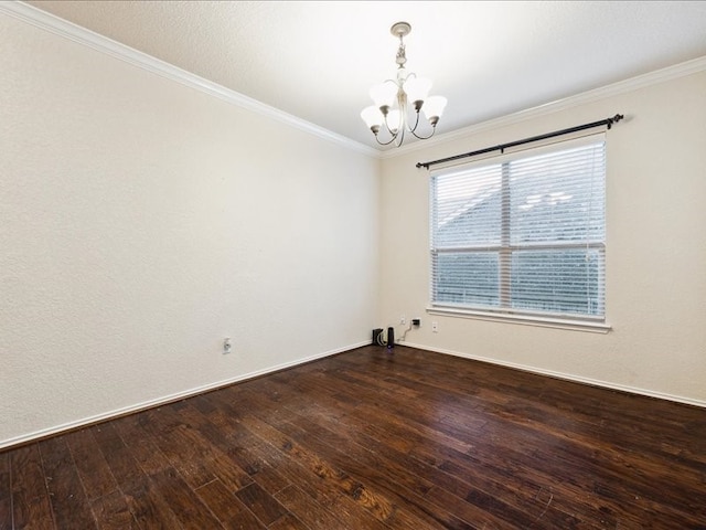 empty room featuring ornamental molding, a chandelier, and dark wood-type flooring