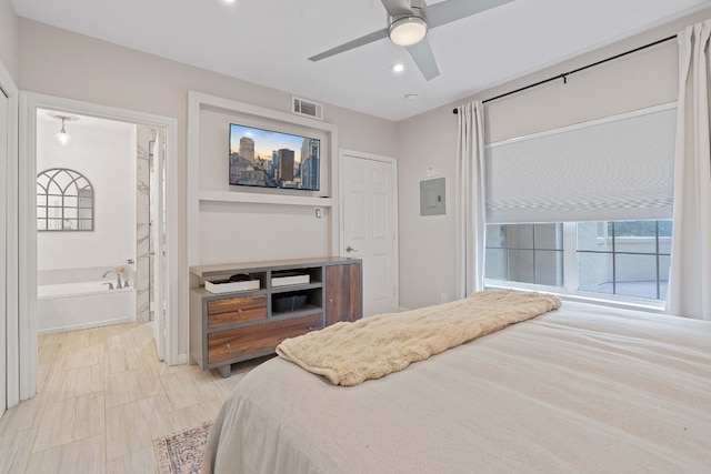 bedroom featuring connected bathroom and ceiling fan